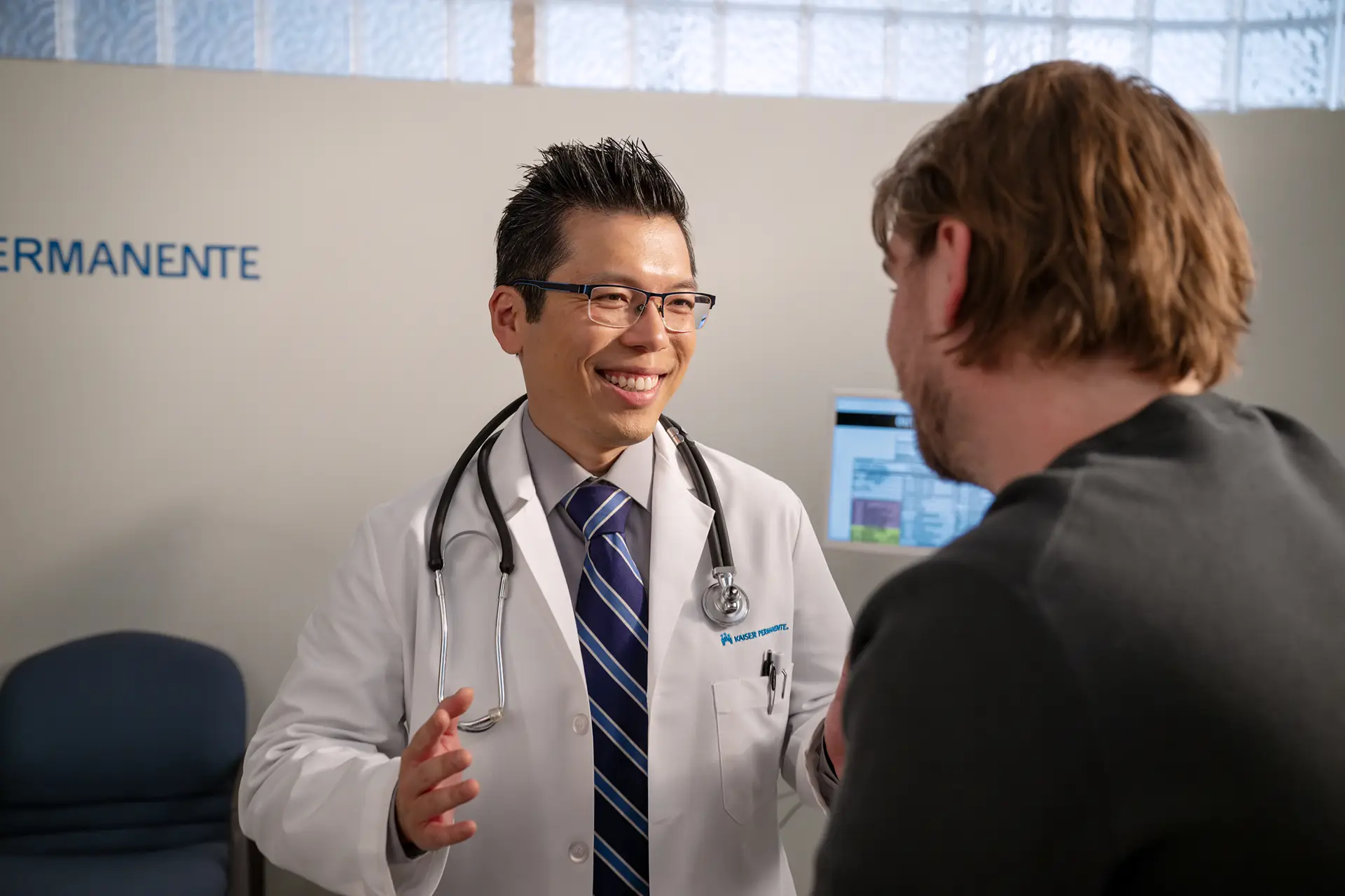 Physician talking to patient